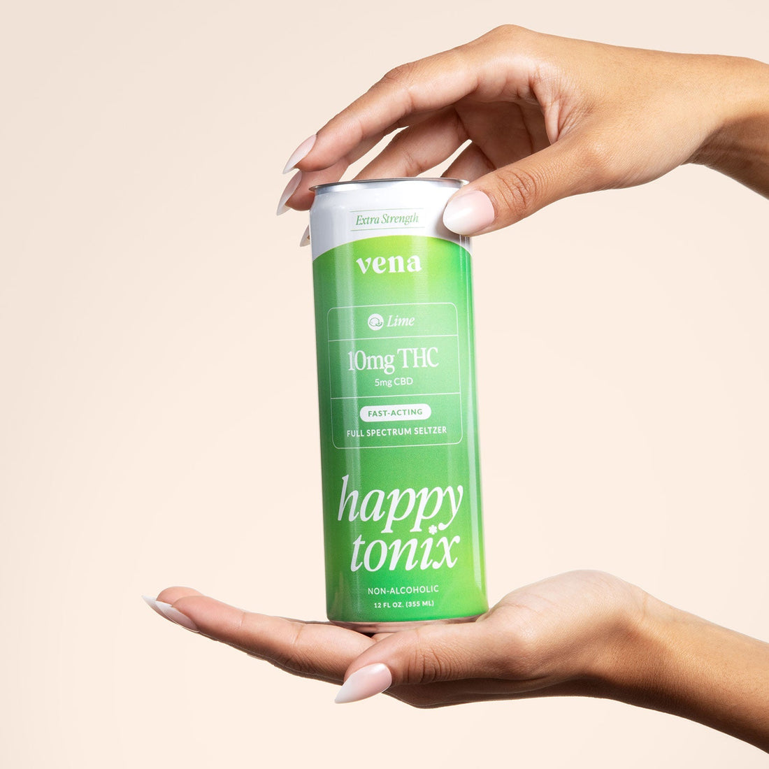 Front view of Vena Lime “Happy Tonix” 10mg THC can held between two hands against a pale beige background