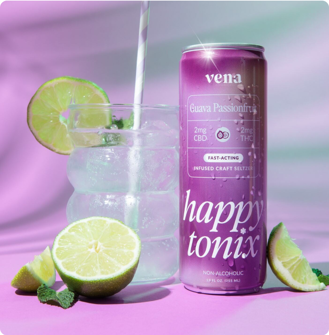 Front view of Vena Happy Tonix can (Guava Passionfruit) showing 2mg CBD and 2mg THC, with a glass of ice and lime on pink background