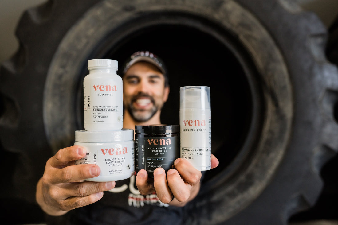 Man holding Vena products labeled: vena, CBD BITES, FULL SPECTRUM, VEGAN, CBD CALMING SOFT CHEWS FOR PETS, COOLING CREAM